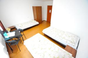 Postel nebo postele na pokoji v ubytování Twój Hostel Bytom