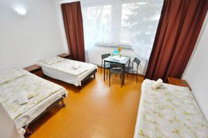 Postel nebo postele na pokoji v ubytování Twój Hostel Bytom