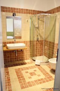 a bathroom with a sink and a shower at Il Principe salento in Mesagne