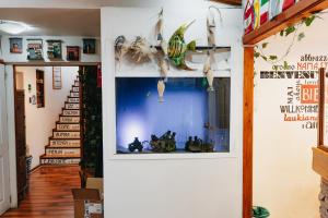 a hallway with a window with fish skeletons on it at Hostal Concepcion in Concepción