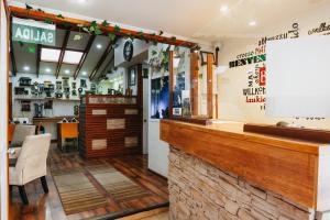 a bar in a restaurant with a counter at Hostal Concepcion in Concepción