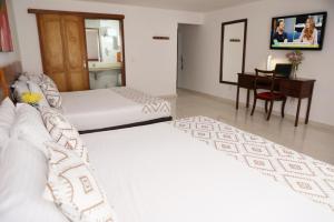 Ένα ή περισσότερα κρεβάτια σε δωμάτιο στο Hotel Guane
