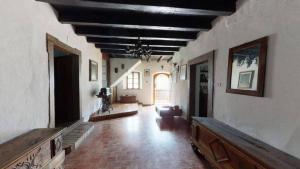 a living room with a large room with a ceiling at Antica Dimora Russit in Mediis