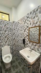 Een badkamer bij Eleven25 Roomstay