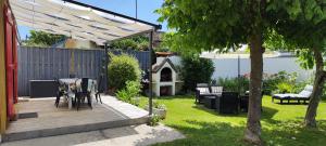 En have udenfor Villa Darom, 7 rue parmentier à Andernos les Bains