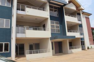 an apartment building with blue and white balconies at RESIDENCE IVOIRE in Accra