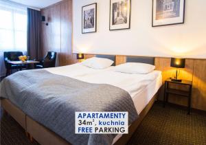 Posteľ alebo postele v izbe v ubytovaní Warsaw Apartments - Apartamenty Sadyba + 37 fotografií