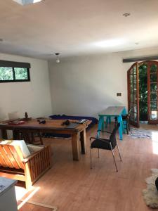 a living room with a table and a couch and a table at “Fluffy loft” in Santiago