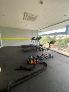 a gym with treadmills and exercise equipment on the floor at Northwoods Place Studio Unit in Mandaue City