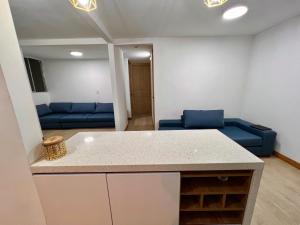 Ruang duduk di Moderno comodo y tranquilo apartamento