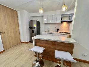 Dapur atau dapur kecil di Moderno comodo y tranquilo apartamento