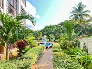 a resort with a swimming pool and a building at Zanoceanique Hotel in Matemwe