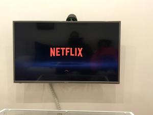 a television screen with the netflix sign on it at FIKA FLAT Casco ViejoPARKING 15 x día in Bilbao