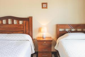 Postel nebo postele na pokoji v ubytování Hostal Claure