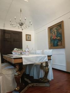 a dining room with a table with a cake on it at B&B - La Corte D'Ivi in Collepardo
