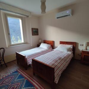 מיטה או מיטות בחדר ב-CantoQuinto Bed and Breakfast