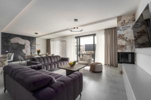 a large living room with couches and a fireplace at Villa Bella Ciao by SeeAdria Agency in Novigrad Istria