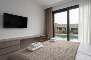 a bedroom with a bed and a tv and a window at Villa Bella Ciao by SeeAdria Agency in Novigrad Istria +88 photos