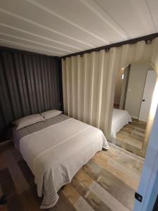 Een bed of bedden in een kamer bij Casita Playa Antofagasta