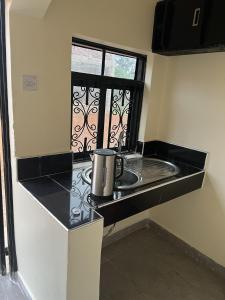 A kitchen or kitchenette at Beautiful 1-Bed Apartment in Gulu