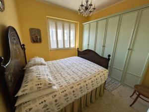 Ένα ή περισσότερα κρεβάτια σε δωμάτιο στο Casa Anna Maria