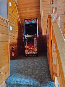 a small room with a large video game in a cabin at Meadows Way 3378 in Pigeon Forge