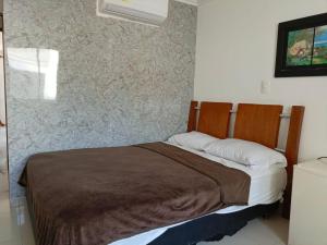 Postel nebo postele na pokoji v ubytování Hotel Palma Real Cartagena