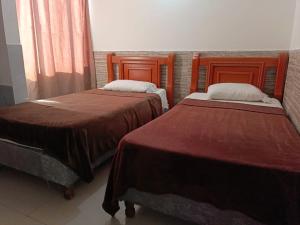 Postel nebo postele na pokoji v ubytování Hotel Palma Real Cartagena