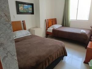 Postel nebo postele na pokoji v ubytování Hotel Palma Real Cartagena