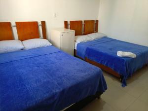 Postel nebo postele na pokoji v ubytování Hotel Palma Real Cartagena