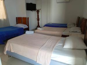 Postel nebo postele na pokoji v ubytování Hotel Palma Real Cartagena