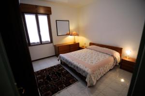 Säng eller sängar i ett rum på Appartamento Colli & Terme