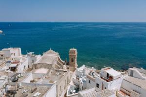 an aerial view of a city and the ocean at Le Contrade Di San Salvatore in Monopoli