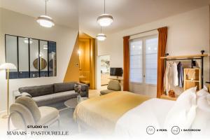 a bedroom with a bed and a living room at Beauquartier - Marais, Pastourelle in Paris