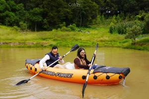 a man and a woman in a raft on a river at Cotan Ecolodge in La Esperanza