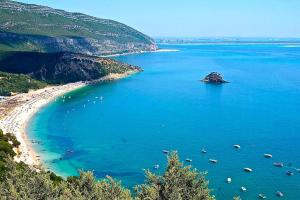 an island in the middle of a large body of water at Casa do Vale-Villa with private pool and garden in Palmela