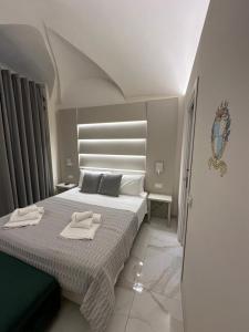 Ένα ή περισσότερα κρεβάτια σε δωμάτιο στο That's Amore Accommodation Tropea