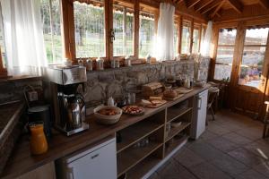 a kitchen with a counter with food on it at Vida Balance Garden in Mythimna