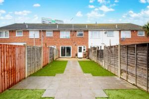 a house with a fence and a yard at EDSPACE in Abbey Wood