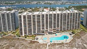 an aerial view of a large apartment building with a pool at Cozy 1BR/1BA Condo w/ Stunning Views in Orange Beach
