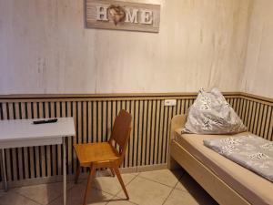 a room with a bed and a table and a chair at Appartment in Oberndorf bei Schwanenstadt in Schwanenstadt