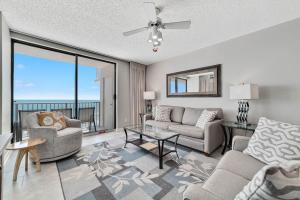 a living room with a couch and a table at Stunning Views, 3BD/2BA w/ Private Balcony in Orange Beach