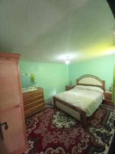 a bedroom with a bed and a dresser at luxury apartment in Marrakesh