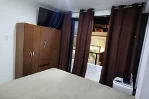 A bed or beds in a room at La Duna de Emy