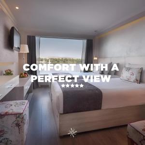a bedroom with a bed and a window with the words comfort with a perfect view at NILE CRUISE LUXOR & ASWAN A in Luxor