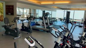 a gym with treadmills and elliptical machines at Alto del Sol Calama in Calama