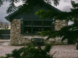 a house with a window with candles in it at The Cosy Coo Shed in Forfar