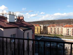 a view of a city from a balcony with buildings at Cozy Apartment nearby Arena in Prague