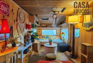 a room with a caravan with a bed and a desk at Bell Tent Lovers by Casa das Artes in Luz de Tavira
