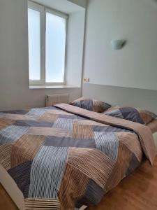 Posteľ alebo postele v izbe v ubytovaní Apartments on Kirova